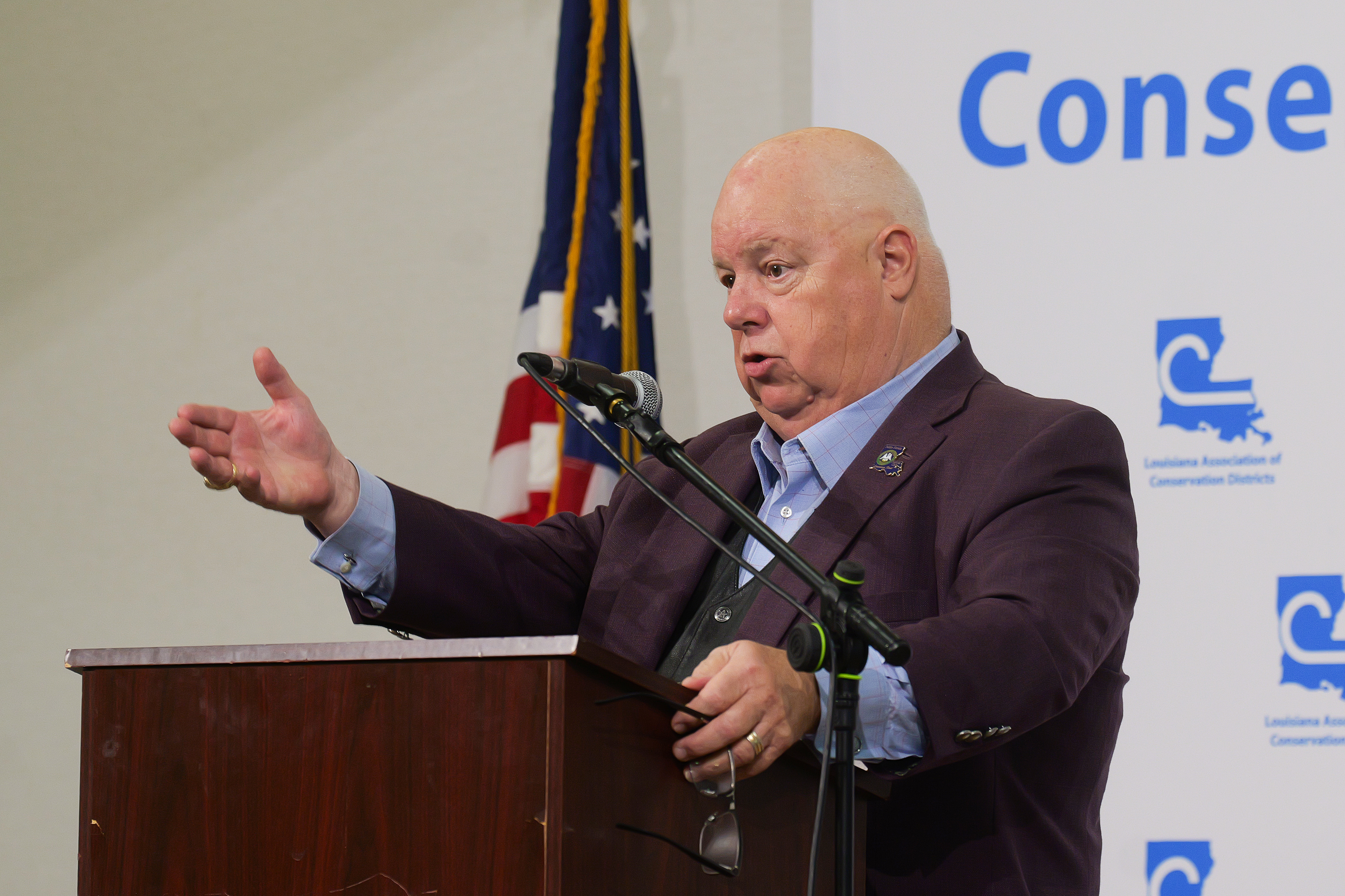 Man speaking at lectern.